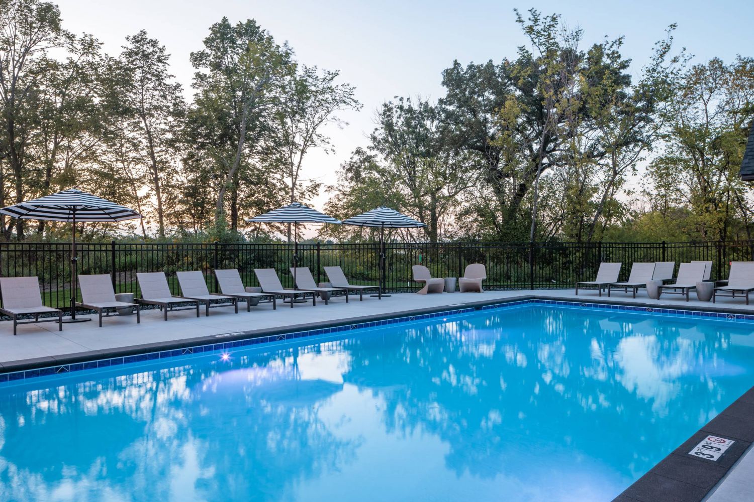 Olive Lane clubhouse and pool with outdoor lounge