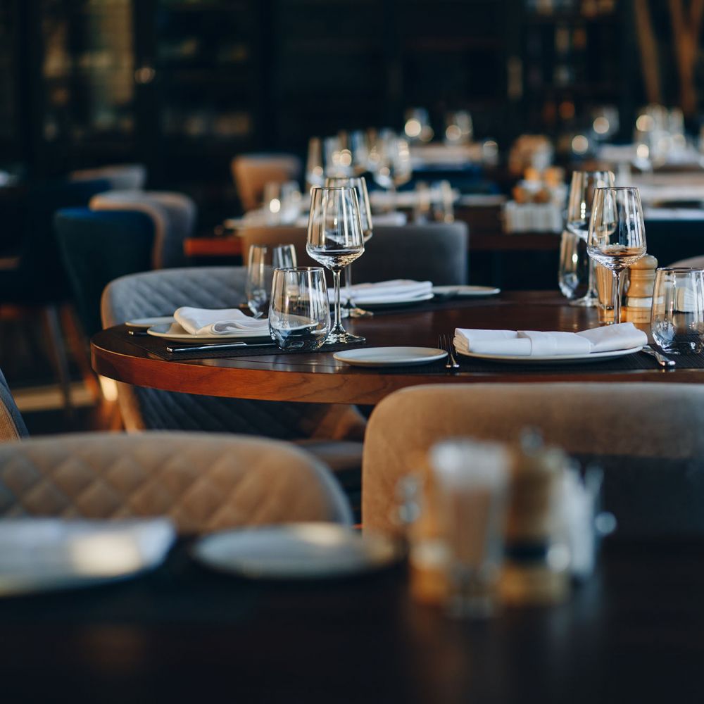 Tableware at a beautiful table setting in fine-dining restaurant